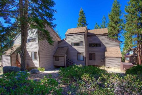 a large house with trees in front of it at Chimney Rock Condo condo in Stateline