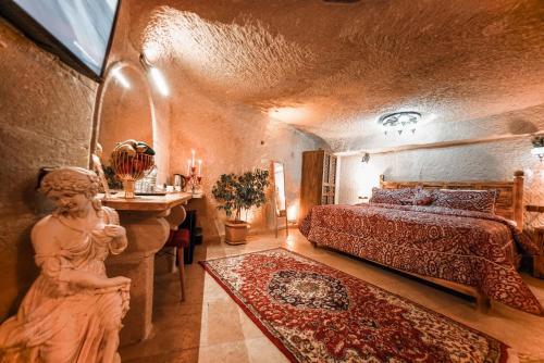 Postel nebo postele na pokoji v ubytování Zeus Cave Suites