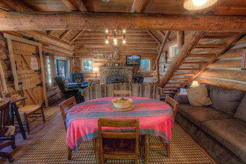 a dining room and living room in a log cabin at Zephyr Cabin home in Zephyr Cove