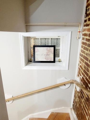 a window in a room with a brick wall at Whole House Walking Distance Stadium Free Parking in Baltimore