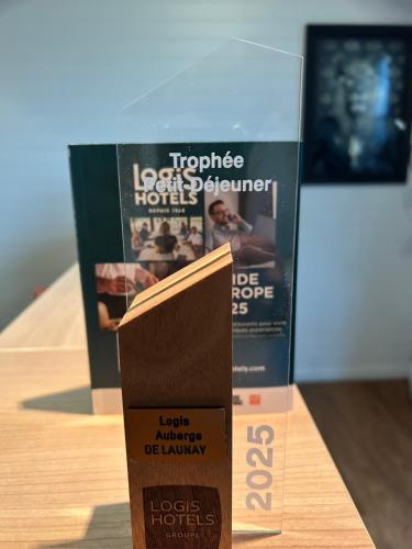 a box on a table next to a book at Logis Auberge De Launay in Limeray