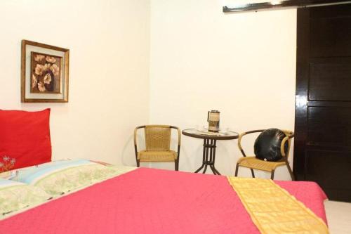 Ein Bett oder Betten in einem Zimmer der Unterkunft St Nicolas Inn CDO City Center