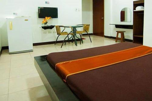 Postel nebo postele na pokoji v ubytování St Nicolas Inn CDO City Center