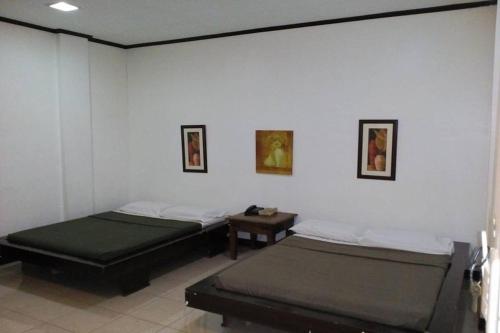 Ein Bett oder Betten in einem Zimmer der Unterkunft St Nicolas Inn CDO City Center