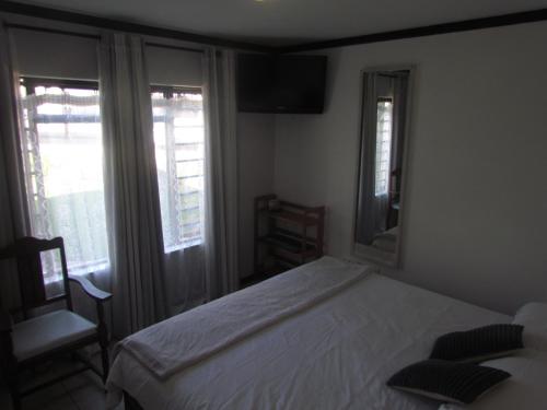 Кровать или кровати в номере Santini Lace Self Catering Unit