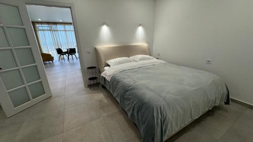Postel nebo postele na pokoji v ubytování Laguna Batumi Apart