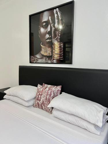 Ένα ή περισσότερα κρεβάτια σε δωμάτιο στο Royal Apartments Nyali 2Bedroom