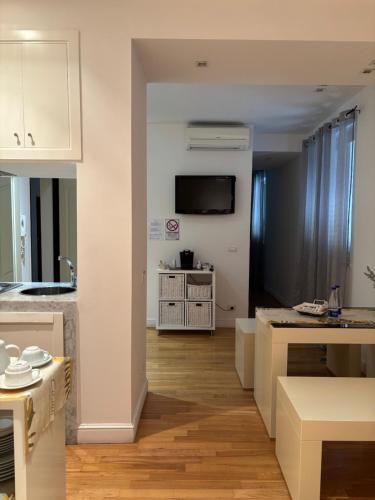 a room with a kitchen and a living room at Casual Stay Galileo in Reggio Calabria