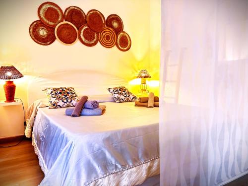 a bedroom with a bed with stuffed animals on it at Residenza MIMOSA - in centro - in Sassari