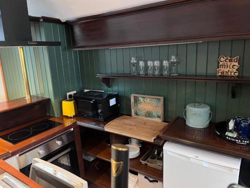 a kitchen with a counter top with a microwave at Top Deck in Killorglin