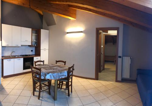 a kitchen and dining room with a table and chairs at Residence Oasi Di Monza in Monza
