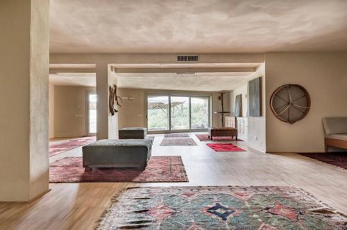 an empty living room with a couch and a rug at Wp Relais Villa Vignalunga in Bagno Vignoni