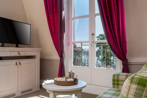 TV a/nebo společenská místnost v ubytování Precise Resort Scharmützelsee - Golf & SPA