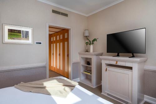 TV a/nebo společenská místnost v ubytování Precise Resort Scharmützelsee - Golf & SPA