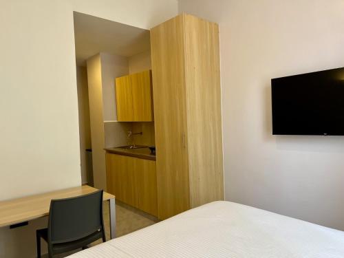 TV a/nebo společenská místnost v ubytování ADANA PODS