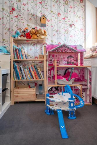 a childs bedroom with a bunk bed and a play area at Parzenica B&B - Wyjątkowa i Jedyna!!! Sprawdź nas a nie pożałujesz! in Białka Tatrzanska