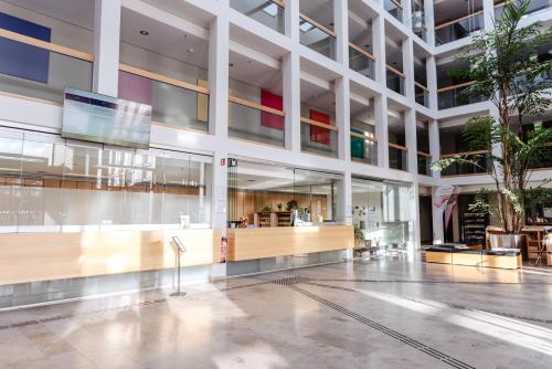 a lobby of a building with a reception desk at Akademie des Sports im LandesSportBund Niedersachsen in Hannover