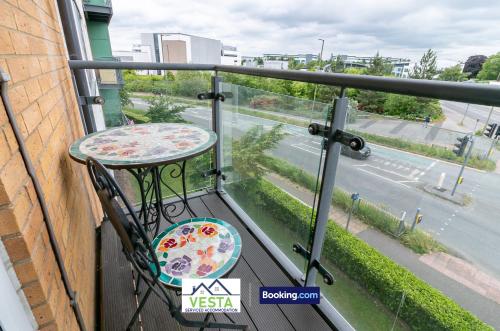 a balcony with a table and a view of a street at Two Bedrooms Apartment By Vesta Serviced Accommodation & Short Lets Hatfield With Free WiFi in Hatfield