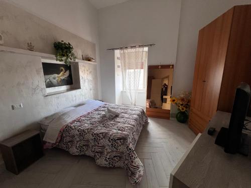Una cama o camas en una habitación de Dimora Atenea