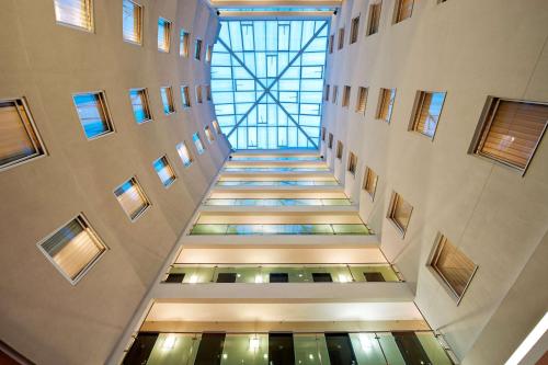 a view from the top of a building with stairs at NH Budapest City in Budapest