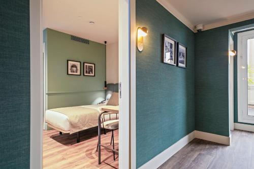Ένα ή περισσότερα κρεβάτια σε δωμάτιο στο Hotel Via Augusta