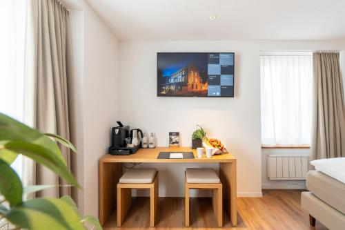 Postel nebo postele na pokoji v ubytování Hotel Artist