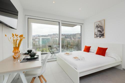 Postel nebo postele na pokoji v ubytování Campus Lugano {30 wonderful Smart Suites} in the university area