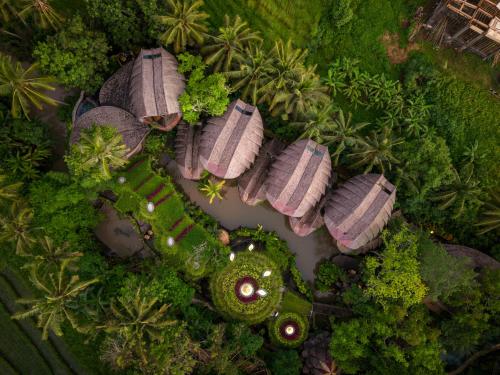 an aerial view of a resort with trees and plants at Ulaman Eco Luxury Resort in Tabanan