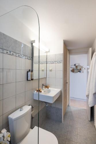 a bathroom with a toilet and a sink at Unique apartment in Corfu Town