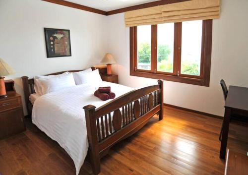 a bedroom with a bed with a teddy bear on it at Thai Villa Melitta Bangrak Bohput, Beach, Pool, SeaViews, 6-enSuite, Full Villa, Luxury, AAA Location Koh Samui in Bang Rak Beach