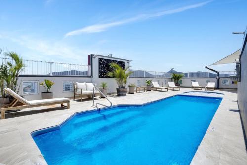 a swimming pool on the roof of a building at Cairns Central Studio 1012 Rooftop Shared Pool & CBD Location in Cairns