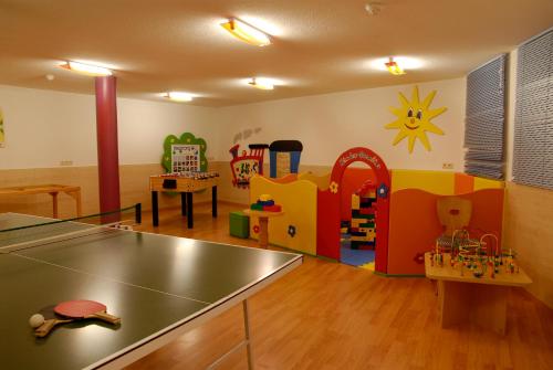 a room filled with lots of different types of play equipment at Hotel Post - OlangCard included in Valdaora