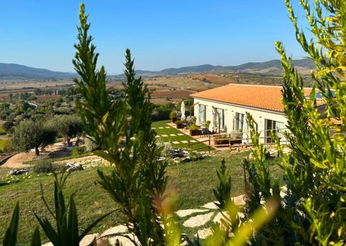 a white house with an orange roof at Agriturismo La Vista - Adults Only in Fonteblanda