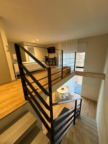 a room with a staircase leading to a bedroom at NEW Douro 901 Mezzanini with parking in Vila Nova de Gaia