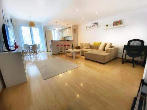a living room with a couch and a table at Musetesti Residential in Bucharest