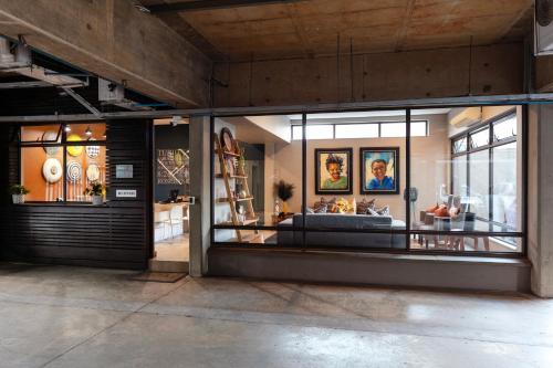 a room with a display window with a couch in it at Akanani Apartments in Pretoria