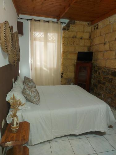 Bed and Breakfast Cala Lunaにあるベッド