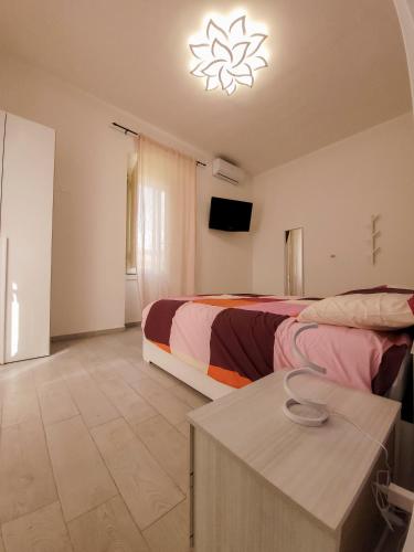 a hotel room with two beds and a table at La Stazione Sabina Alloggio Turistico in Stimigliano