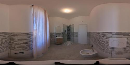a bathroom with a shower and a toilet in it at La Stazione Sabina Alloggio Turistico in Stimigliano