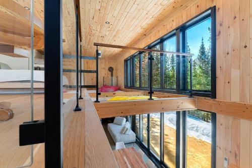 a house with a view of the forest at Chillwood - Sauna & Cold Plunge - Hammock Beds in Notre-Dame-de-la-Merci