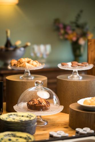 a table topped with plates of pastries and desserts at Dimora Ghirlandaio in Impruneta