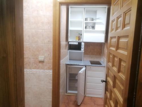 Kuchyň nebo kuchyňský kout v ubytování Apartamentos Turísticos Villa y Corte