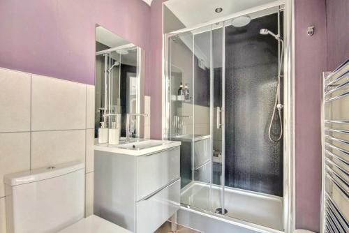 a bathroom with a shower and a sink at Thistle Apartment Golspie in Golspie