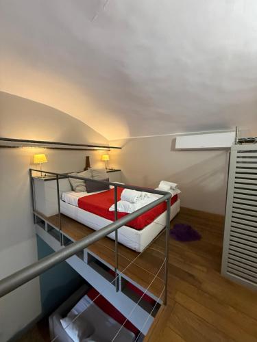 a bedroom with a bunk bed in a room at Palazzo Cambiaso Albergo Etico Genova in Genova
