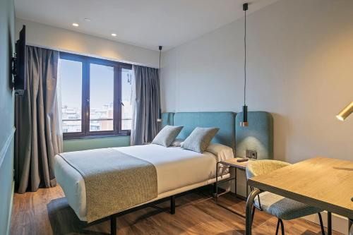 Ένα ή περισσότερα κρεβάτια σε δωμάτιο στο Hotel Via Augusta