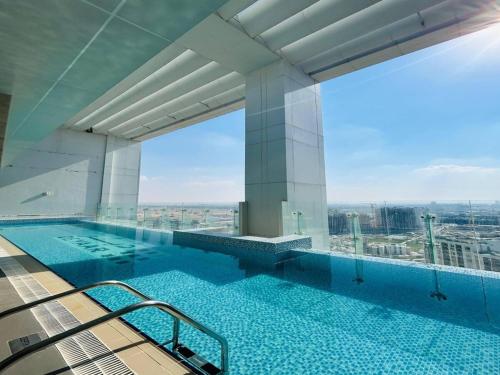 a swimming pool on the top of a building at MontRose residence Tower A 1BR Apartment in Dubai