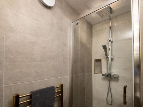 a shower with a glass door in a bathroom at Beautiful Alnwick Apartment One in Alnwick
