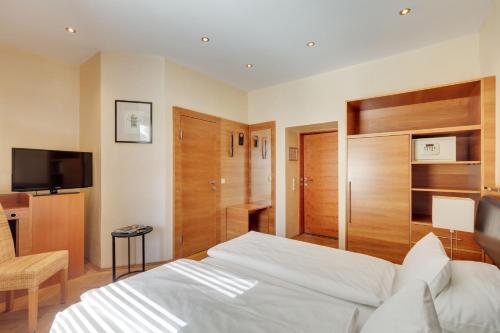 Postel nebo postele na pokoji v ubytování Hotel Central