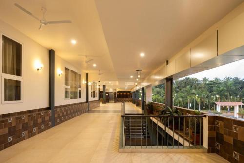 an empty hallway of a building with a staircase at Premier Greens in Mūlki