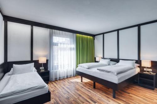 Postel nebo postele na pokoji v ubytování Hotel Central